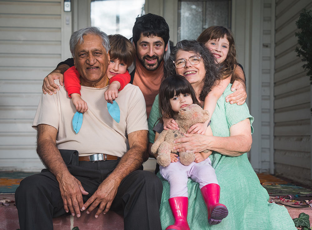 Dr Kumar with his family on a house porch